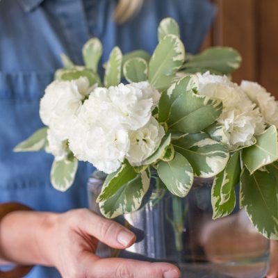 Don't save fresh flowers for special occasions! With a few simple tricks, I'll show you how to make a lovely flower arrangement for less than five dollars.